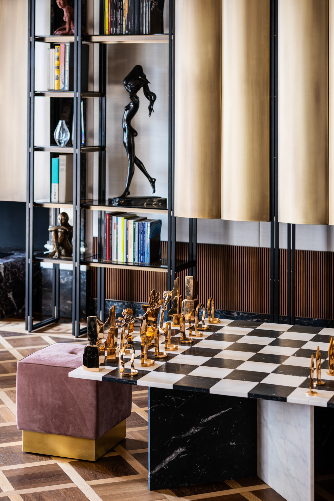 Chessboard table in black and white marble with gold pieces
